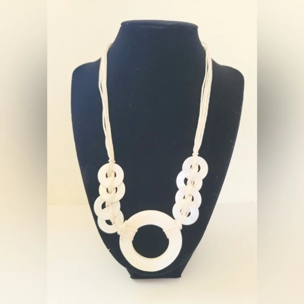 Shell like bead and cord necklace!
